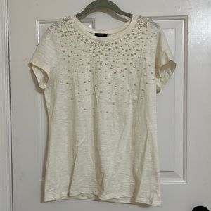 White M short sleeve t shirt with white pearls on front.